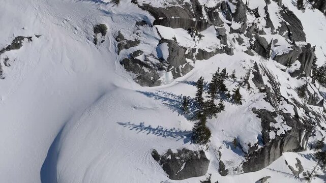 Majestic Aerial View Of Snow-Covered Mountains And Forests In British Columbia, Canada During Winter