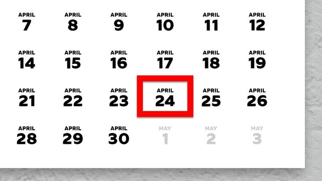 The date April 24th marked with a red cursor on the wall calendar 2026