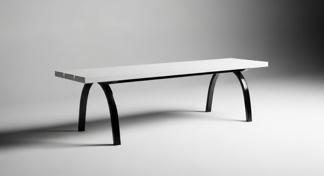 A minimalist white table with black metal legs on a plain background