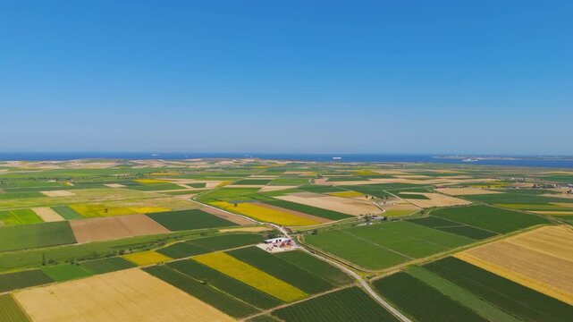 Tevfikiye, Turkey. Surrounding Ancient city of Troy agricultural fields and the Dardanelles strait in the distance on a summer day. Aerial view, MasterShots, Panorama