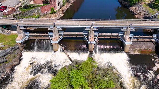 Woonsocket Falls Dam and Glenark Mills building on Blackstone River aerial view in downtown Woonsocket, Rhode Island RI, USA.