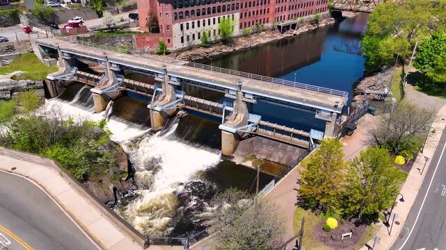 Woonsocket Falls Dam and Glenark Mills building on Blackstone River aerial view in downtown Woonsocket, Rhode Island RI, USA.