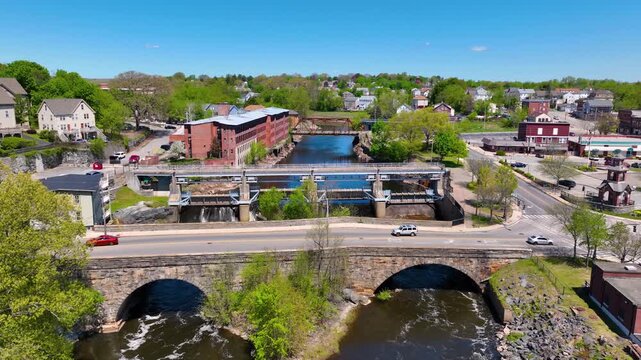 Main Street Bridge and Woonsocket Falls Dam on Blackstone River aerial view in downtown Woonsocket, Rhode Island RI, USA.