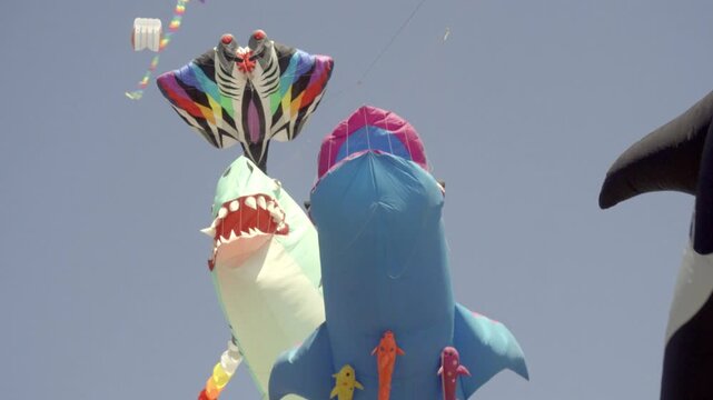 Low angle view of giant kites flying at festival in Cholula Mexico