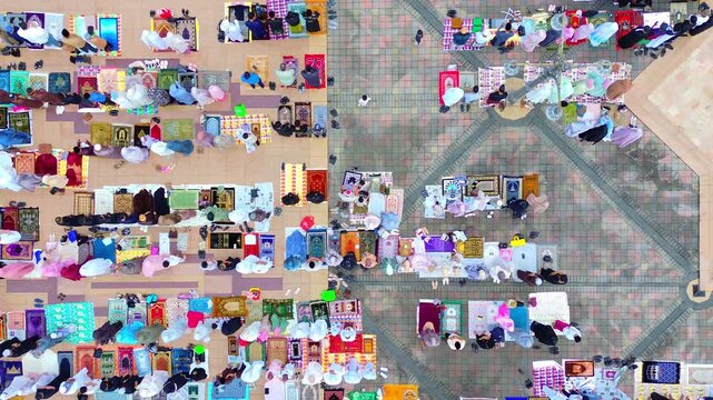 a view of the moslem congregation is praying Eid. Prayers outside the islamic centre mosque samarinda.