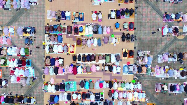 a view of the moslem congregation is praying Eid. Prayers outside the islamic centre mosque samarinda.