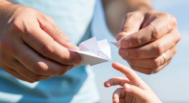 Hands exchanging a piece of paper.