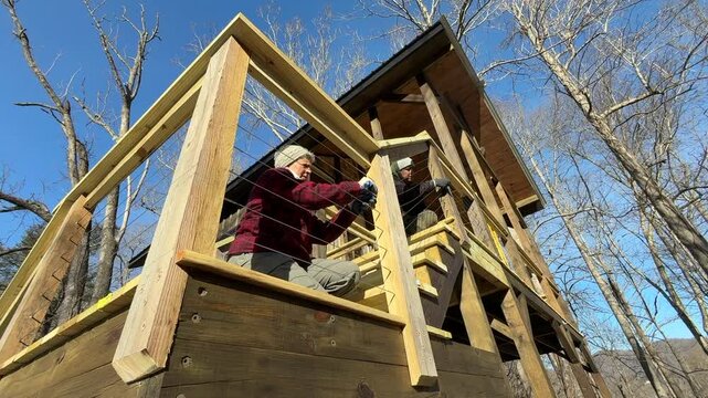 Attaching and tightening cables on railing
