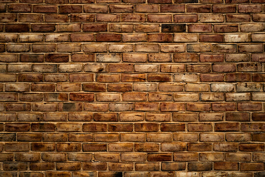 Brick wall, vintage texture. Red brick wall for construction themes. Old bric kwall background. Textured bricks for design projects. Solid bricks, wall structure close-up. Brick wall pattern.
