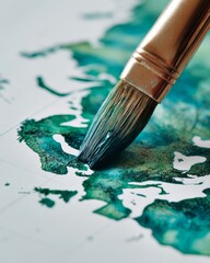Fototapeta premium Map icon being painted with a brush, creative process