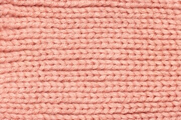 Fototapeta premium Pink knitted sweater fabric pattern background