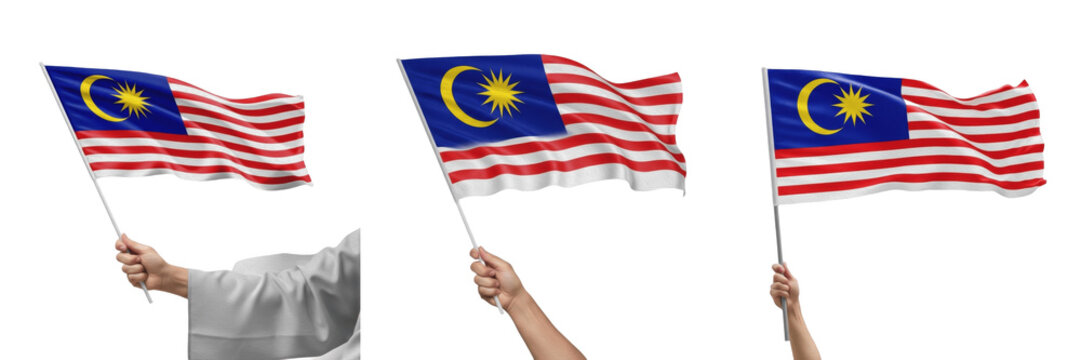 Hand holding Malaysia flag and waving national flag of Malaysia isolated on white background, patriotic symbol of Malaysian national pride and Jalur Gemilang