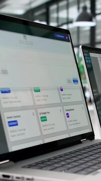 Archivist Carefully Organizes Digital Files On Notebook