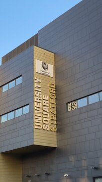 London UK - 07.01.2025 university of east london university square stratford building facade with modern architecture and signage in warm evening light urban academic campus