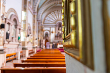 Obraz premium Soft Focus Interior View of an Ornate Catholic Church with Wooden Pews