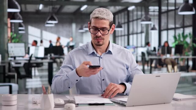Office Worker Carefully Taking A Photo Of A Document