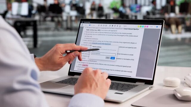 Proofreader Carefully Reviews Laptop Document