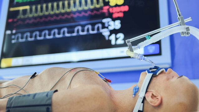 Medical simulation training with intubated mannequin and vital signs monitor
