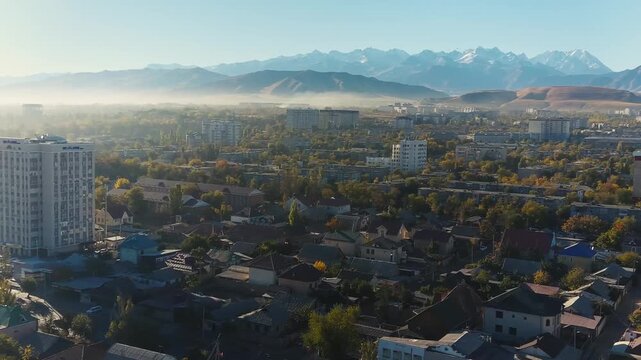 Beautiful Central Asia panoramic aerial video of Trans-Ili Alatau mountains and Bishkek, capital of Kyrgyzstan, view.
