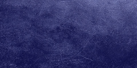 Fototapeta premium Dark blue scratched and textured background with subtle gradient effect for design and creative projects