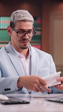 Lawyer Happily Reads Good News Letter About Successful Legal