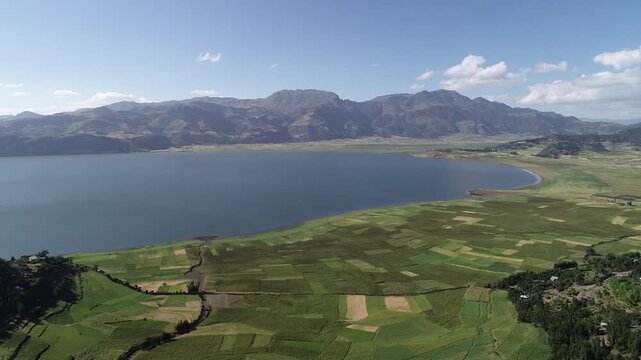 Aerial Dolly-In View of Lake Hashenge and Agricultural Highlands, Southern Tigray, Ethiopia