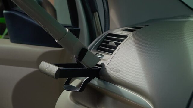 People using vacuum cleaner to clean mpv car interior, warn morning light, natural background