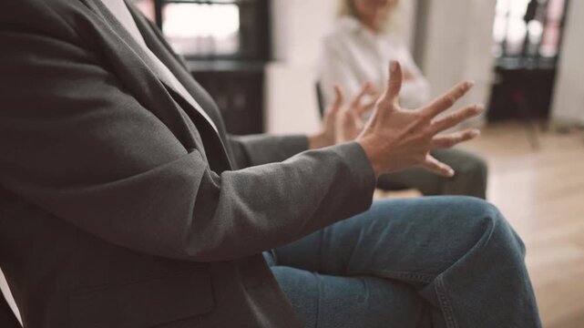 Ladies in group therapy in psychologist office, details view, emotions release. Woman gesticulating by hands when talking about her life and problems, excite feelings, brainstorm in business meeting