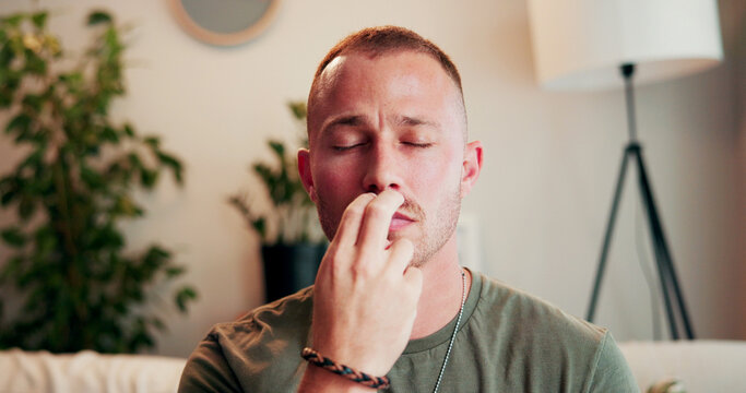 Breathe, therapy and man on sofa for holistic healing, mindfulness or calm for counseling. Psychology, somatic therapist and person with pressure point for awareness, regulate emotions or eft tapping