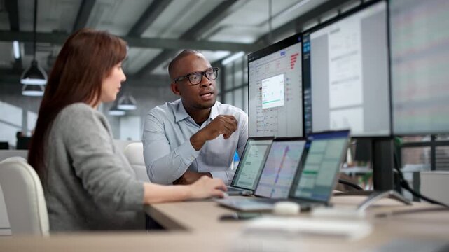 People Using Computer Software For Tax Invoice Preparation