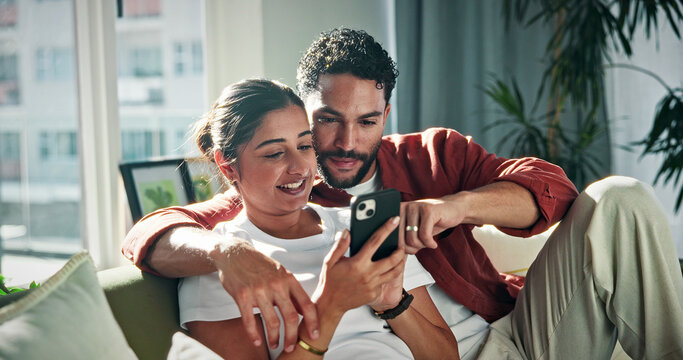 Relax, talking and couple on sofa with phone for social media, networking and bonding on weekend. Marriage, happy and man with woman on smartphone to scroll internet, website and connection in home
