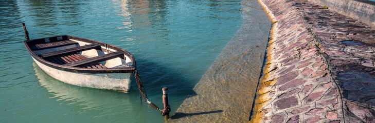 Obraz premium Landscape with lake and boat. Boat near pier