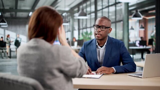 Unhappy Young Woman At Disciplinary Meeting