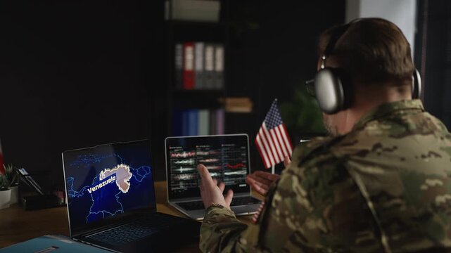 American service member in headset controlling military operation in Venezuela