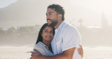 Hug, smile and thinking with couple on beach together for anniversary, date or honeymoon in summer. Holiday, love and vision with happy people embracing outdoor for bonding, travel or vacation