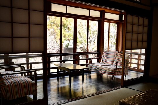 Japanese Traditional Interior with Wooden Veranda, Shoji, and Mid-Century Modern Chairs