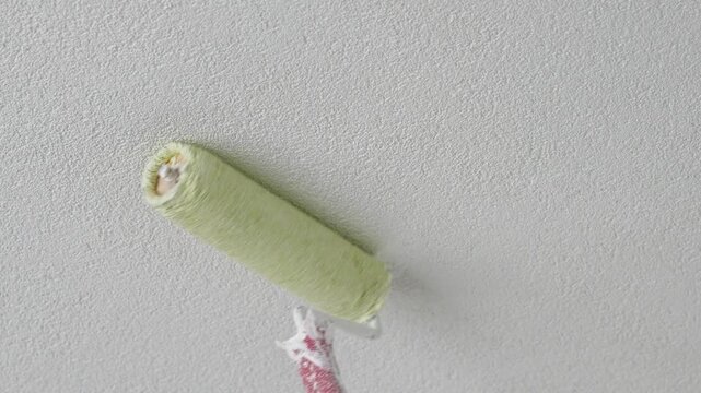 Painting White Wall with Roller Close Up &ndash; Home Renovation, Interior Painting, DIY House Improvement