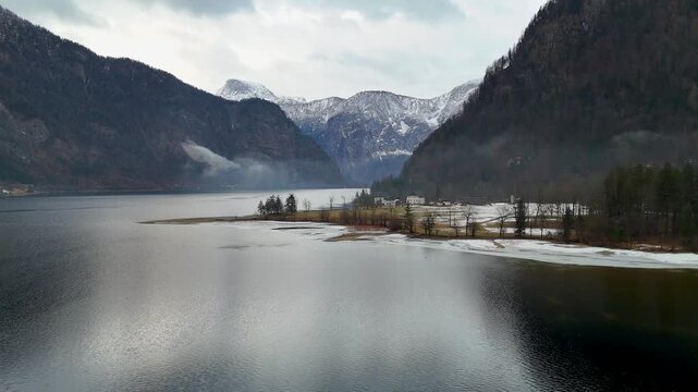Aerial view of lake hallstatt and snowy alps in austria