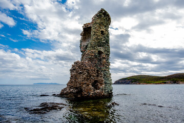 Ruined Stone Tower in Coastal Sea © Alvise