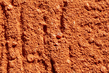 Fototapeta premium Orange exterior pulled plaster macro background texture