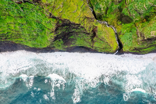 Aerial view of Garganta Funda waterfall and coastline in Madeira