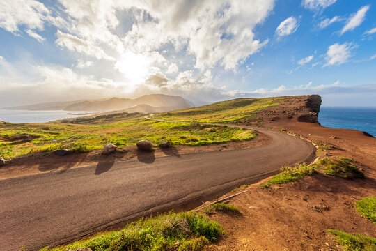 Curved road with scenic coastal cliff view in Cani�al Madeira