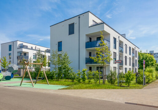 Modern KfW 55 energy efficient apartment buildings with playground in Neus��