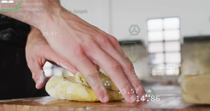 Vertical video: Pressing right hand man in dark apron shaping dough to bake at bench with green HUD