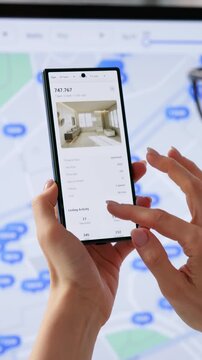 Real Estate Agent Carefully Searches Property Listings Online Using Computer