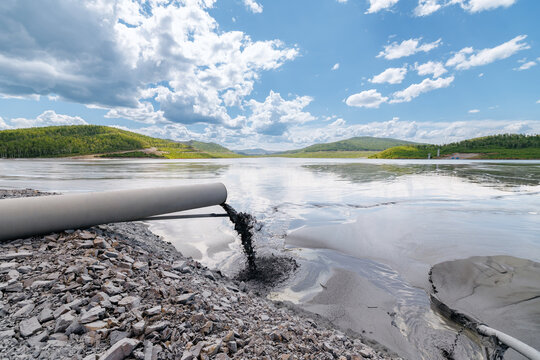 Pipeline discharging slurry onto mining industry sludge ponds of Copper, iron ore, tailings storage facilities