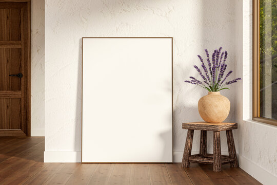 White frame and lavender vase on chair over parquet floor and wooden door in white plaster wall room
