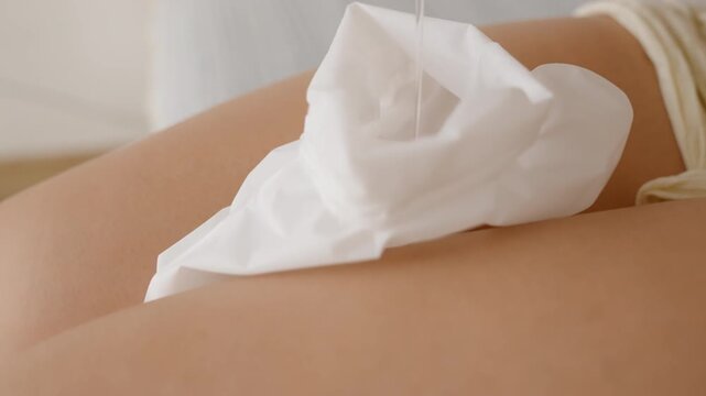 A Close-up shows liquid being poured into white socks on a woman's lap, highlighting the preparation for a foot peeling treatment.