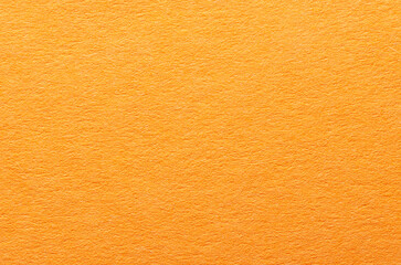 Fototapeta premium Orange paper background or backdrop with fine details and smooth texture with copy space for text design element