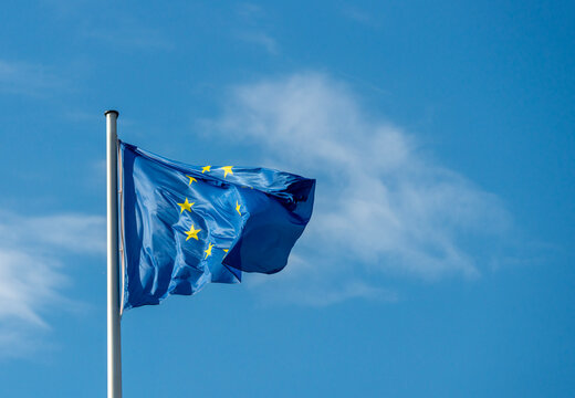 European Union flag symbolizing EU politics, trade, security and regulation in 2026 Close-up of the waving European Union flag, conceptual image for EU institutions, trade policy, support for Ukraine,